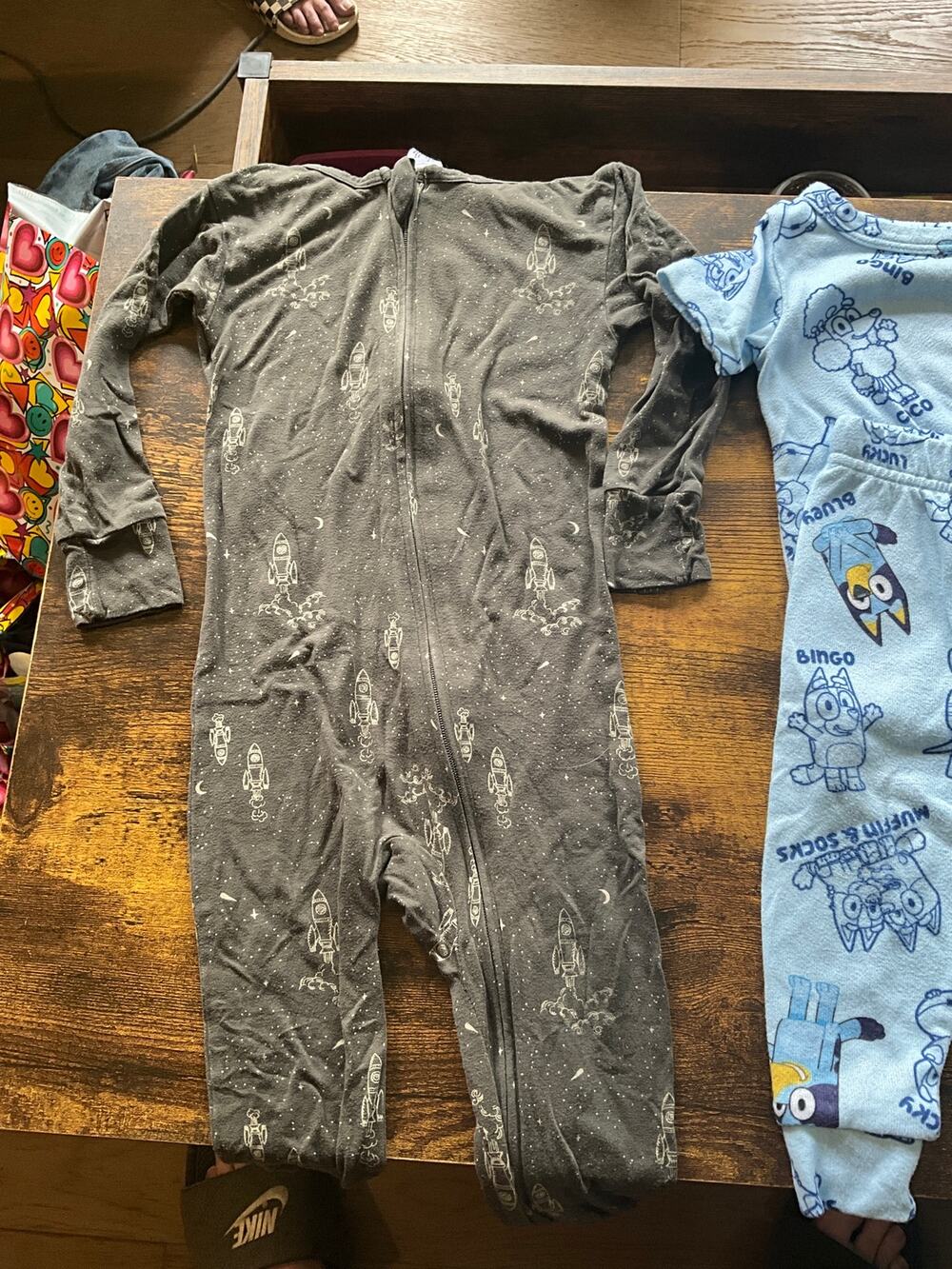 Leo of 6. 18M Sleepers, onesies and shorts Bluey Space